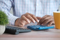 Adding up bills with a calculator