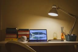 Working late by lamp light