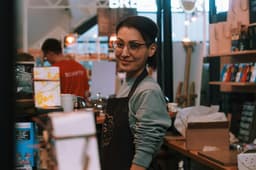 A small business owner at her shop counter